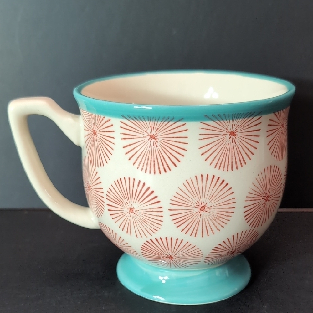 The Pioneer Woman Turquoise/Red Starburst Footed Happiness Mug.